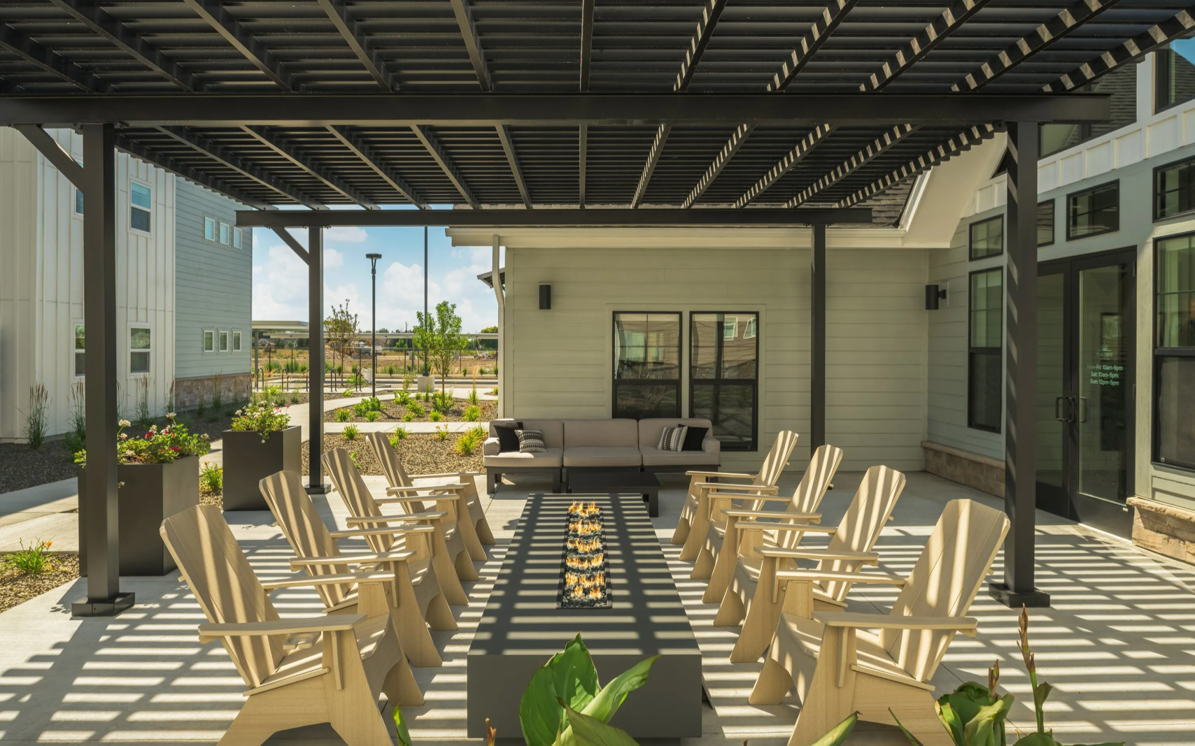 Outdoor poolside kitchen and communal seating.