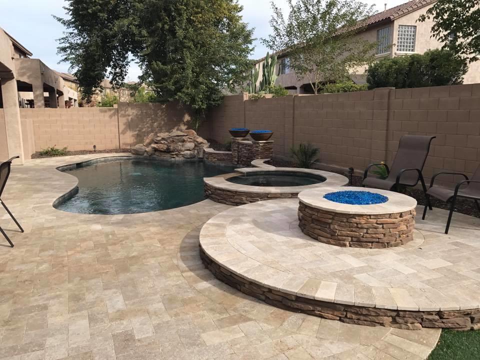 New construction freeform pool with spa spillover, firepit, and pavers No Limit Pools & Spas Mesa (602)421-9379