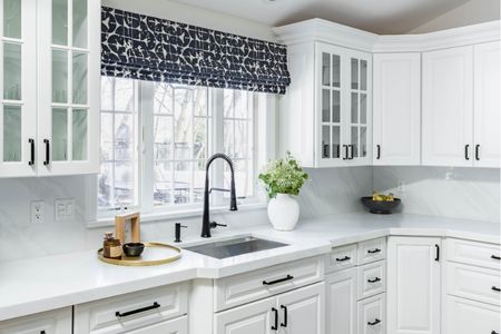 Patterned faux Roman valances bring refined style to this North Shore kitchen while offering dependable light control for bright mornings and evening prep.