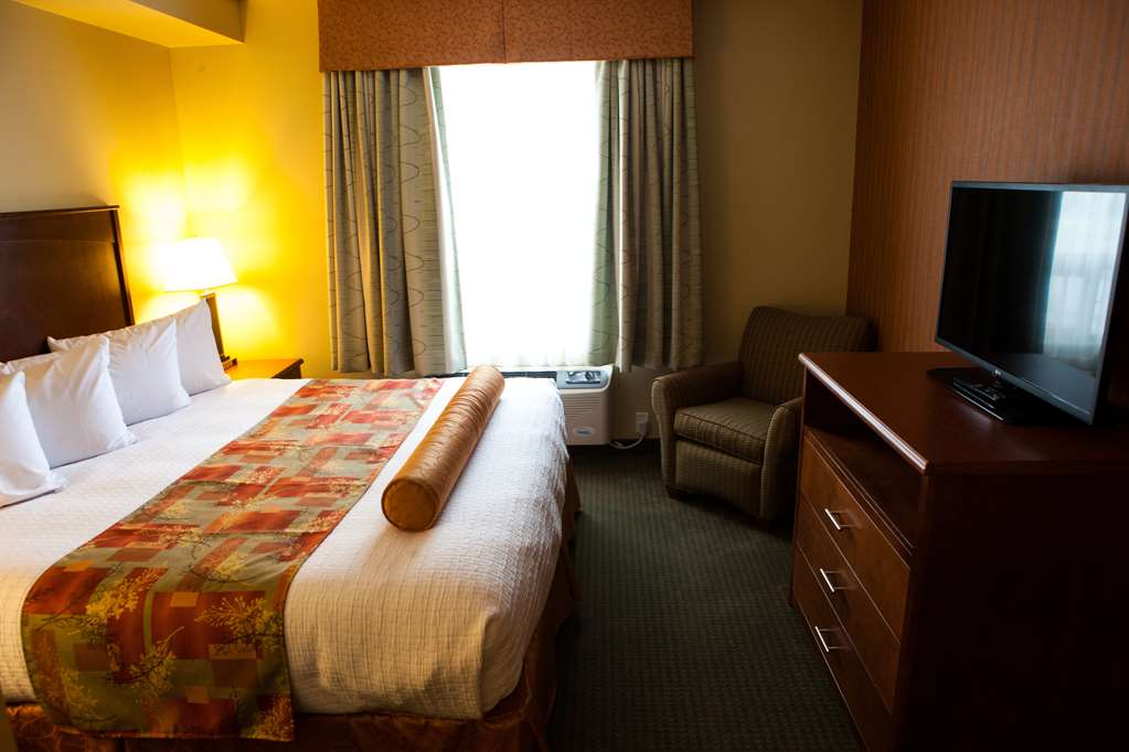 Junior Executive King Suite Bedroom Best Western Plus Service Inn & Suites Lethbridge (403)329-6844