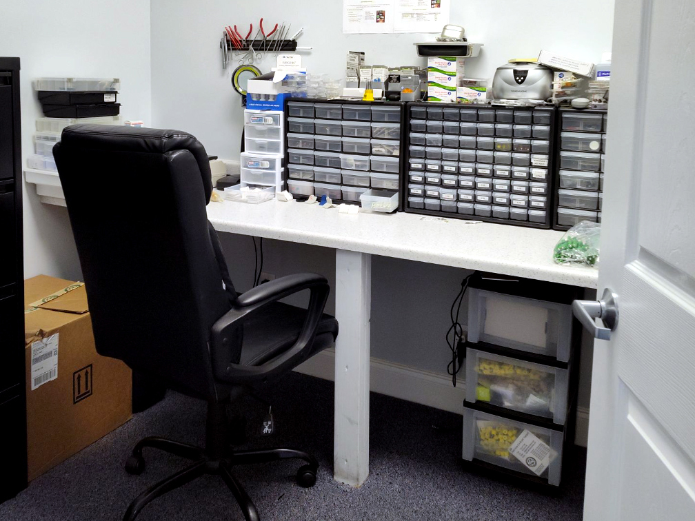 Interior photo of the hearing aid lab for AudioNova hearing clinic in Jupiter, FL