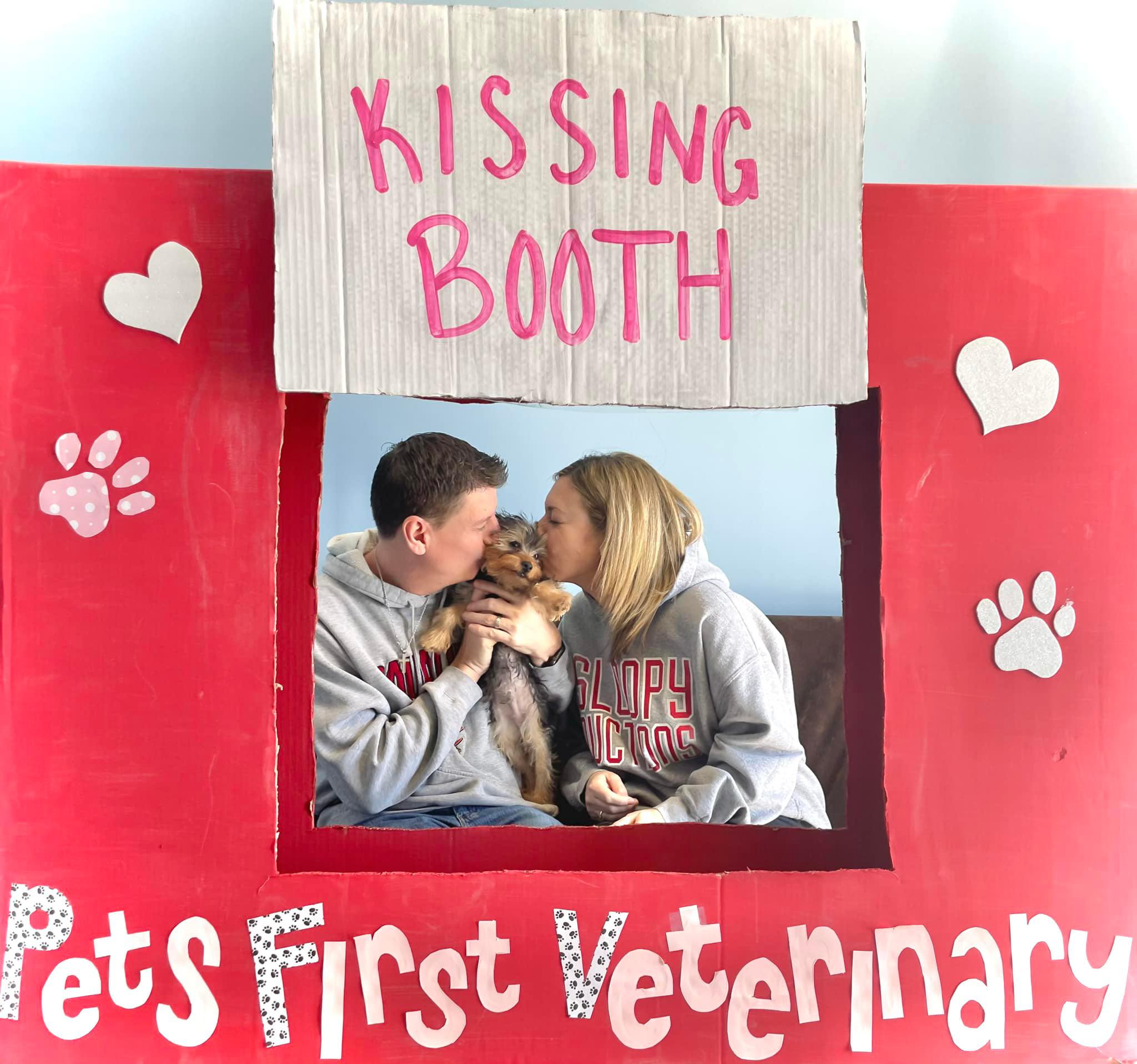 kissing booth with puppy