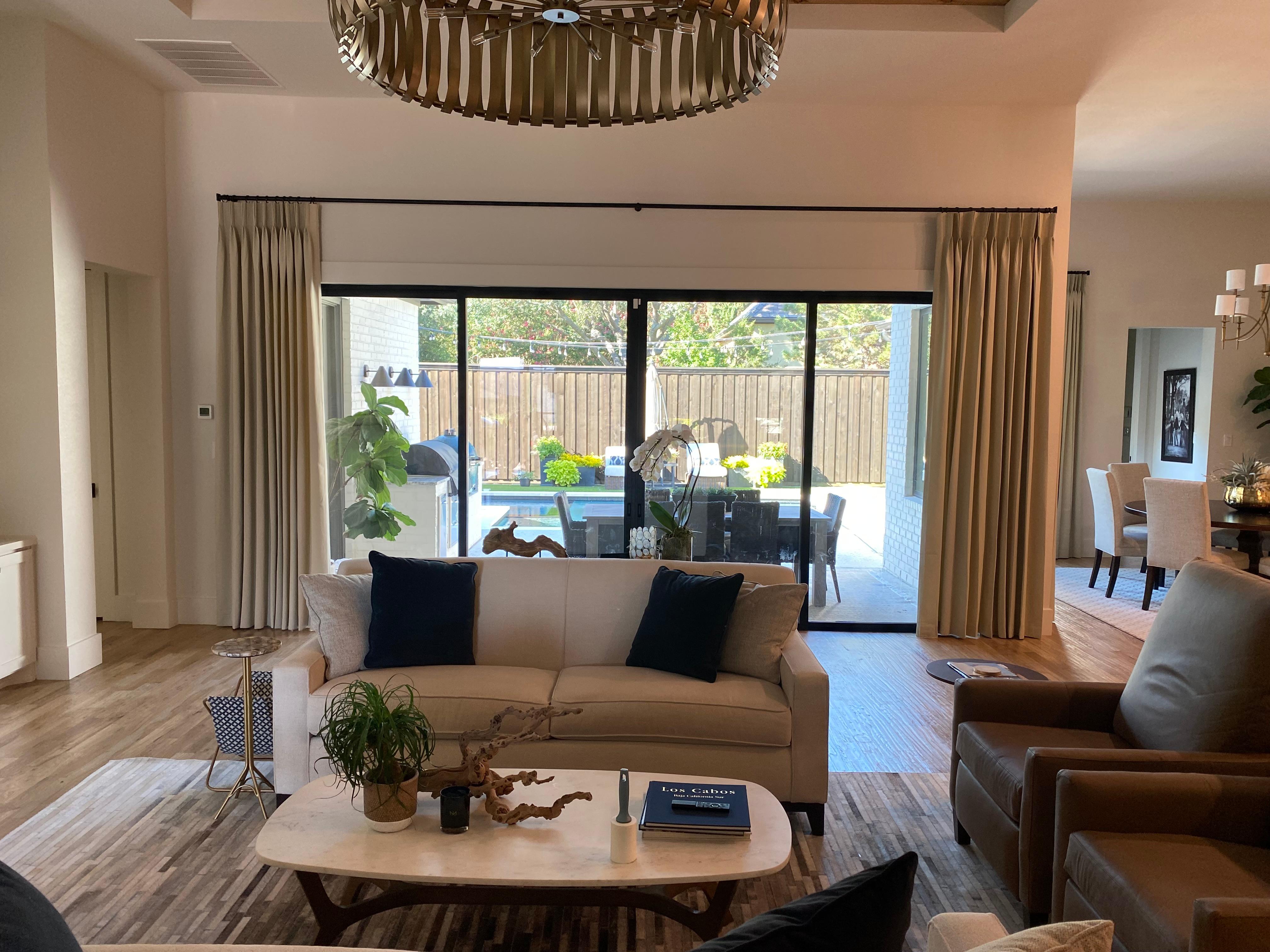 Pleated Drapery is a great option for living rooms with large windows and patio doors. We have a wide variety of fabrics the design team at Budget Blinds of Rockwall, Terrell, and Greenville utilizes to get the perfect match for your style.