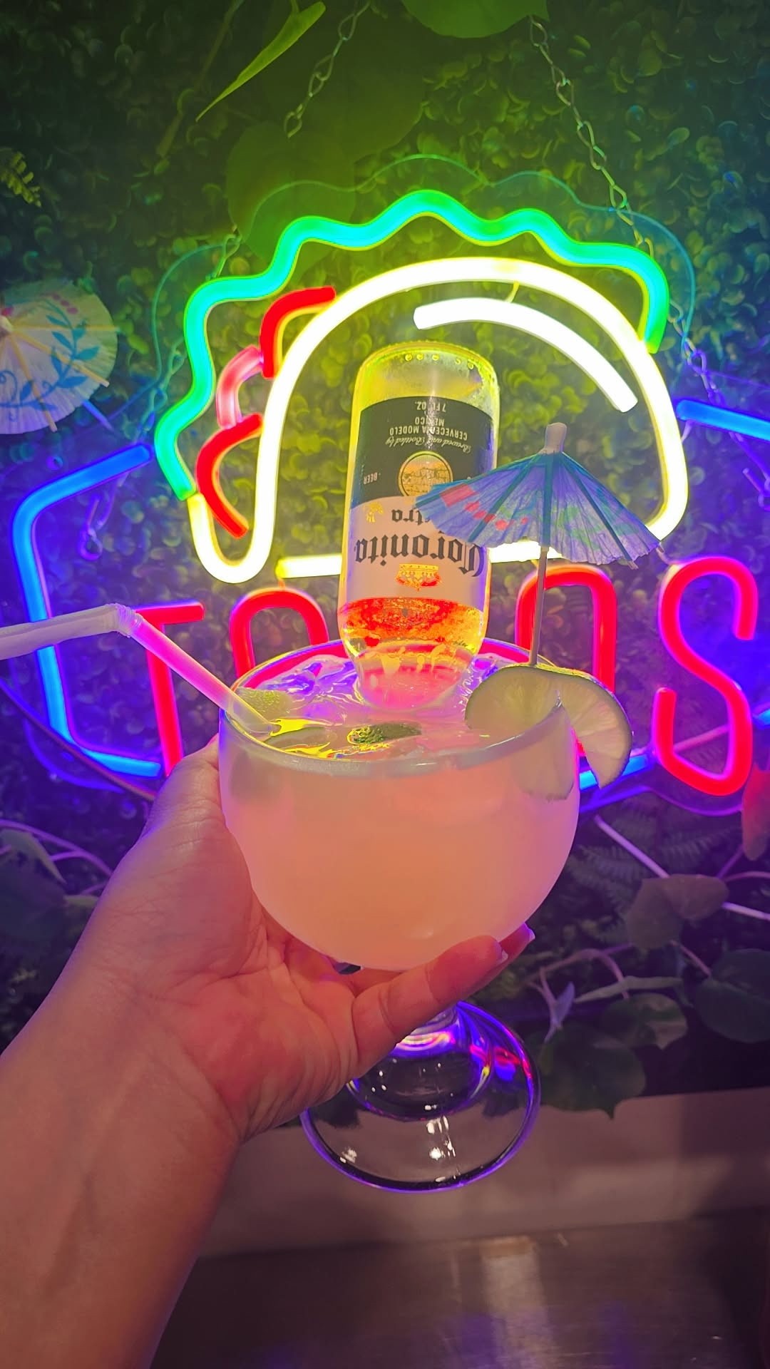 Signature margarita-style cocktail served at Catramex Restaurant featuring a refreshing mixed drink topped with an inverted Corona beer and authentic Mexican-inspired flavors in Southern Maine.