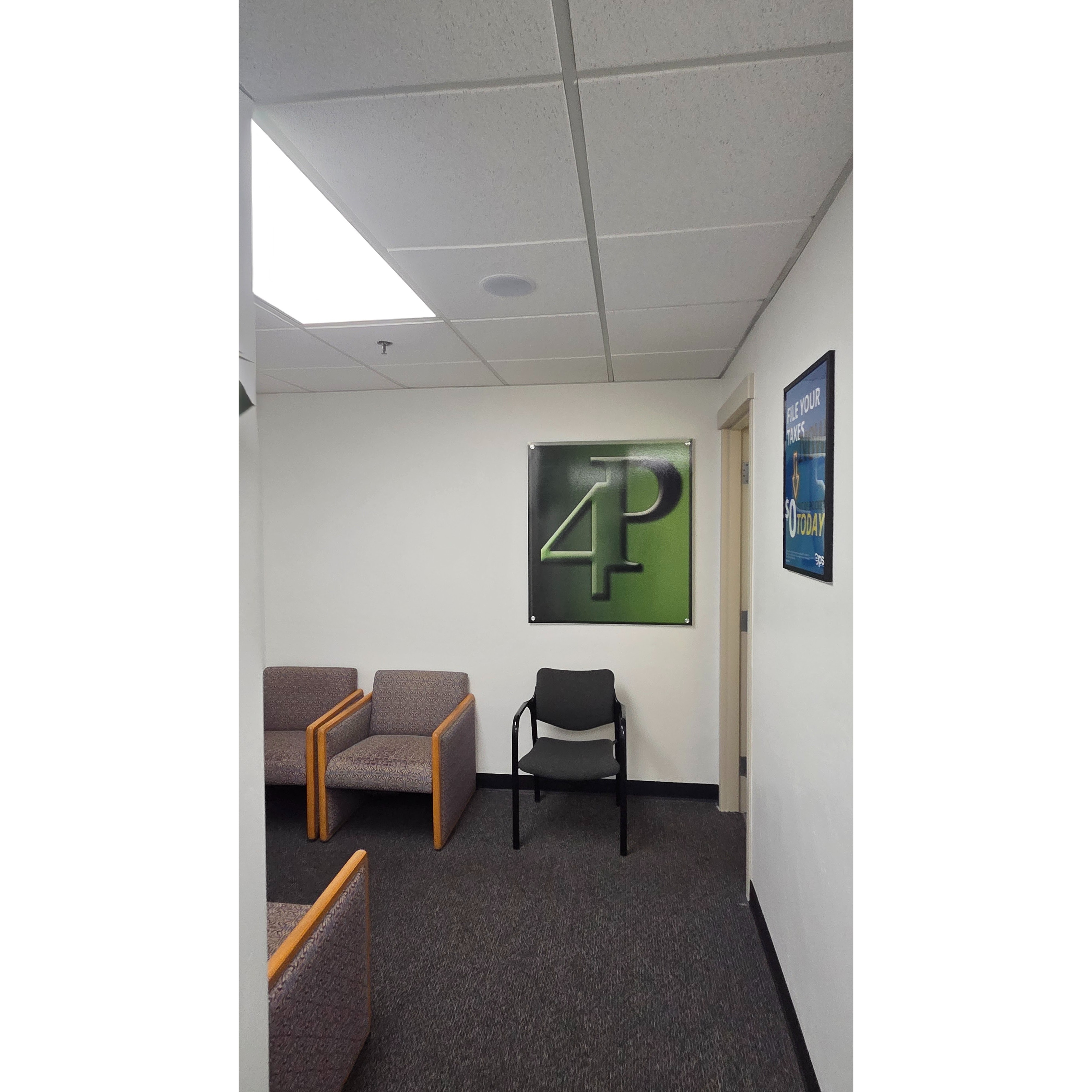 Interior view of 4P Taxes office, showing the client waiting area with the 4P logo. This office provides tax preparation, business tax services, bookkeeping, payroll, accounting support, and bilingual assistance for clients.