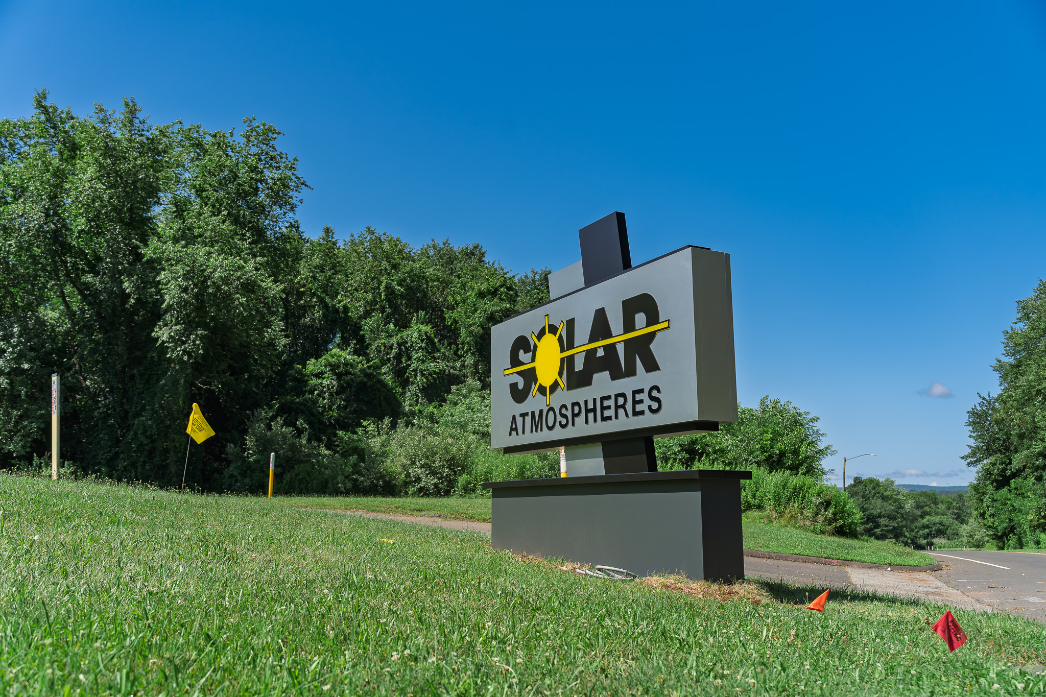 Illuminated monument sign designed, fabricated, and installed by Sign Pro for Solar Atmospheres, giving the business a clear and professional exterior identity.