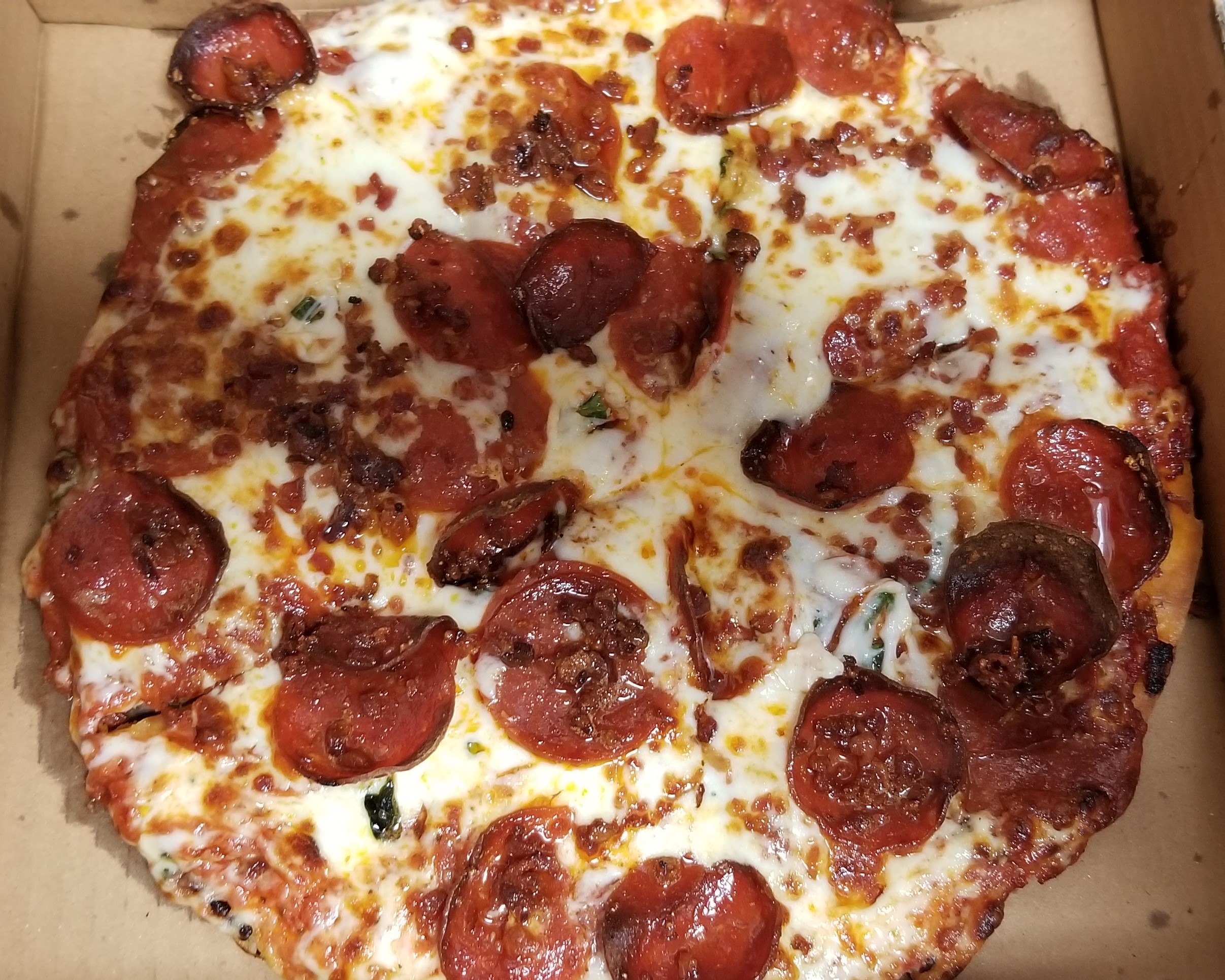 Classic Pepperoni Amore with basil and bacon added to it!