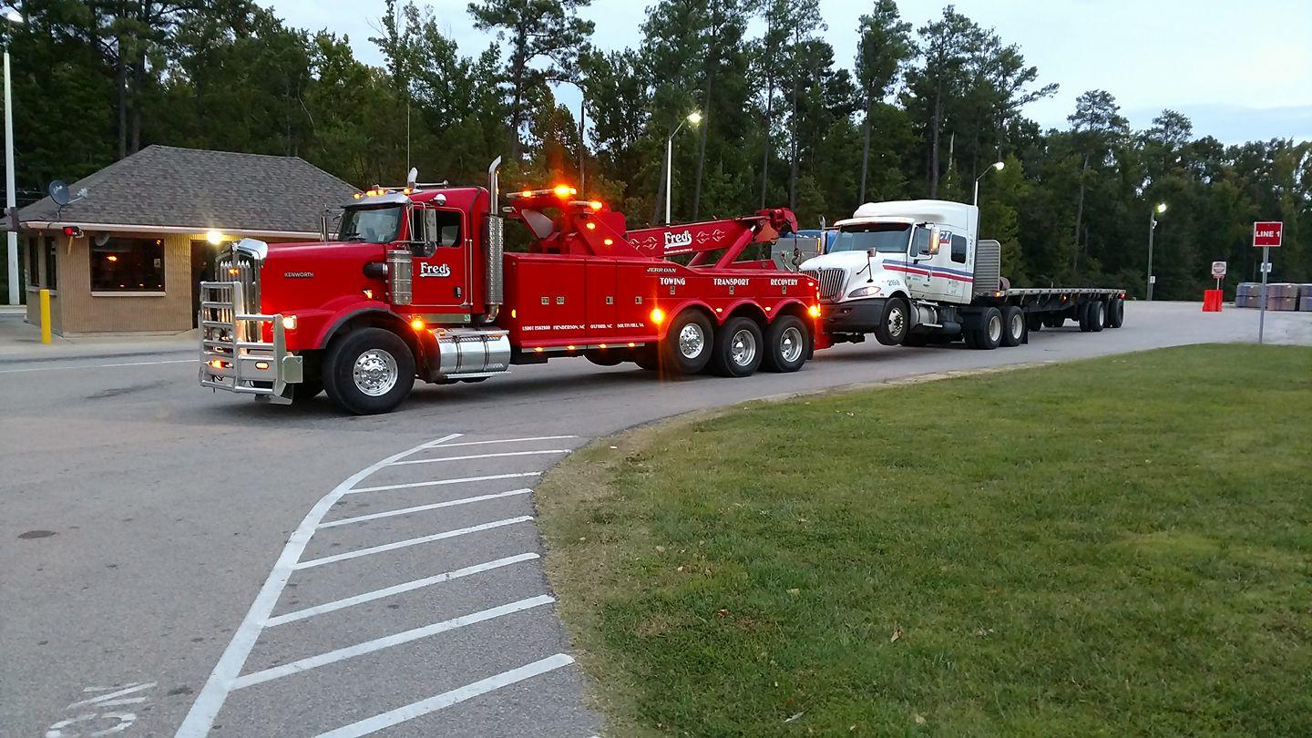 Fred’s Towing & Transport Inc. is a locally owned and operated business proudly serving the Tri-County area since 1989. You can always put your confidence in our state of the art fleet because we are the Tri-County’s largest Towing & Transporting company. We specialize not only in heavy-hauling up to 90 tons, but also light to heavy-duty towing. To provide the utmost in accurate and efficient service, our fleet operates with a computerized tracking and dispatch system so you are always assured of a fast and accurate response. We also have an array of trailers that can meet your various hauling needs and a professional staff of certified drivers that provide safe precision services to the East Coast areas. We strive to bring 100% customer satisfaction and we provide 24/7 service 365 days a year!

Fred's specializes in heavy truck repair, heavy truck equipment hauling, heavy tire repair, and all types of specialized towing.
We Accept: Visa, Mastercard, Comchecks, EFS, Fleetone
Our Heavy Duty Towing Services Include:
Light, Medium, Heavy Duty Towing | Recovery Services | Heavy Hauling | Transloading | Export Crating & Packing | Crane Services | Configure & Dismantle of Machinery | Short/Long Term Storage

Freds Towing and Transport - Heavy Duty Towing (252) 430-0082 | fredstowing.com