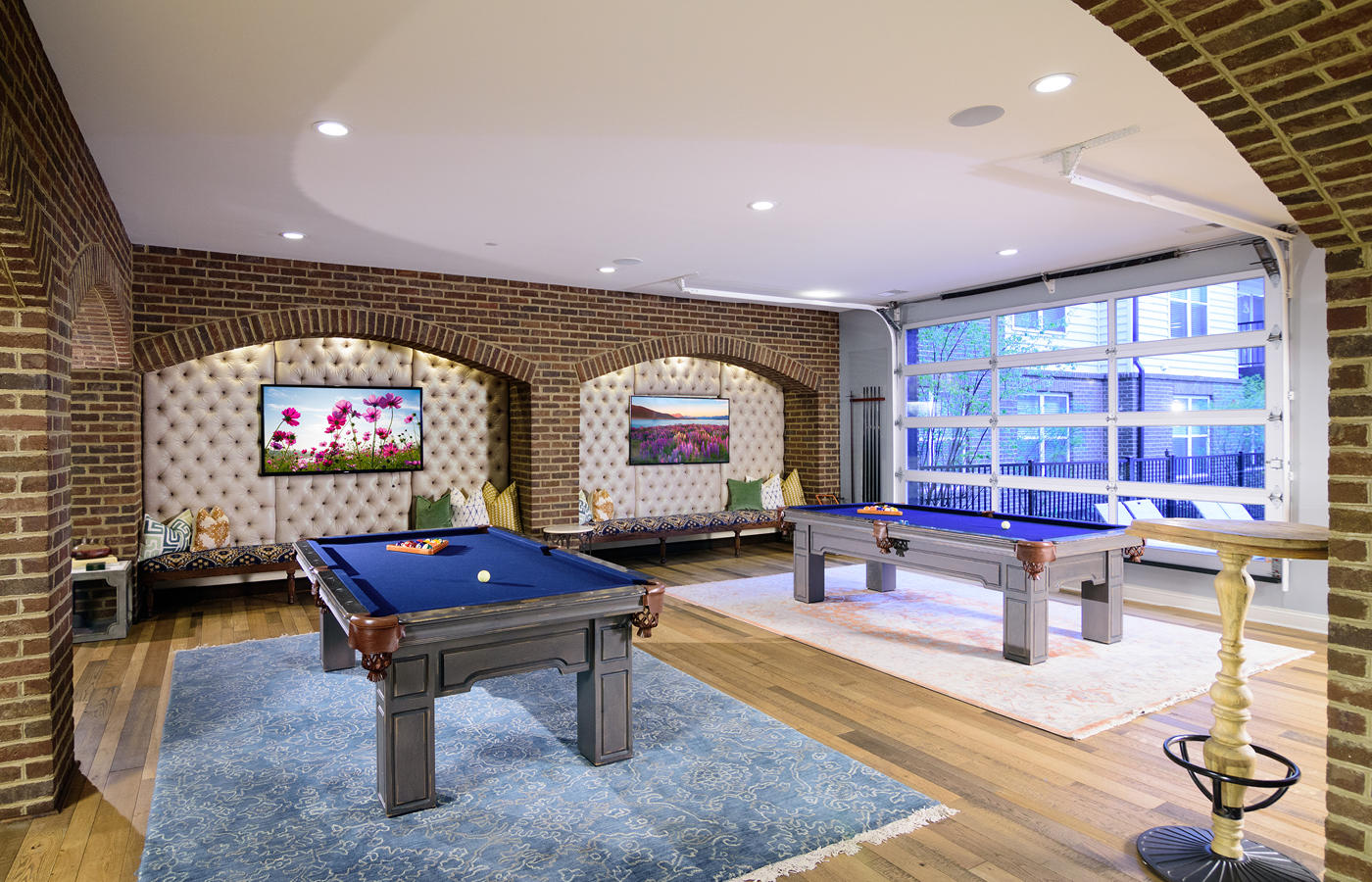 Bar area with HDTV wall and two billiards tables