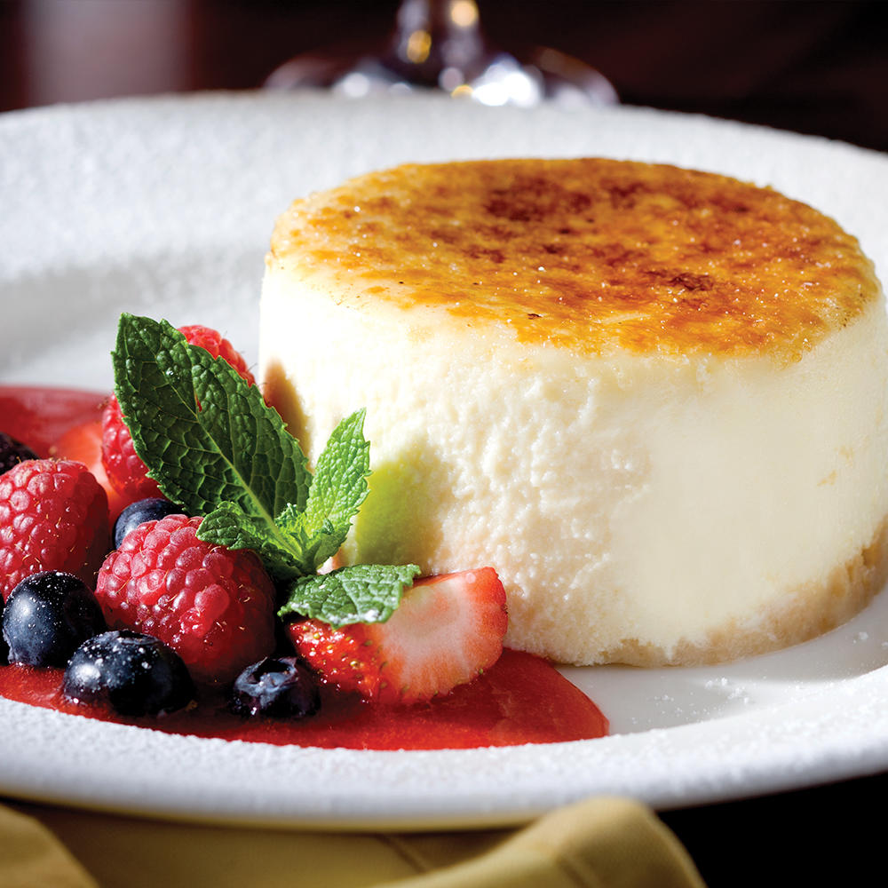 The Capital Grille Cheesecake brûléed to order by our in-house pastry chef and served with fresh ber The Capital Grille Stamford (203)967-0000