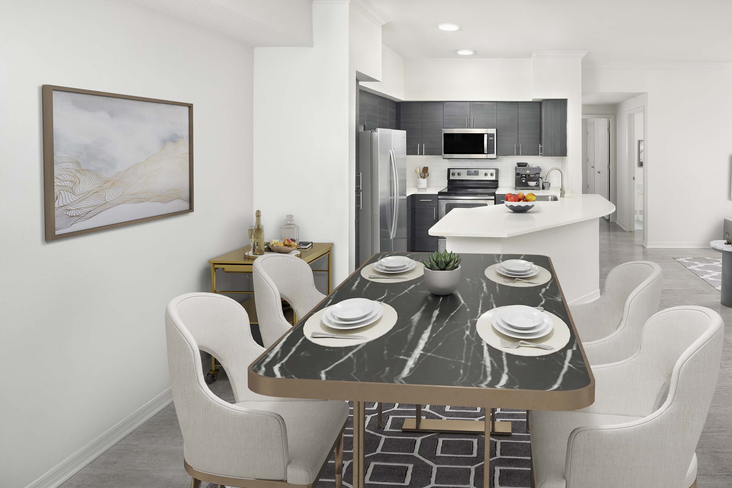 Dining and kitchen with wood-look flooring throughout at Camden Lee Vista apartments in Orlando, FL