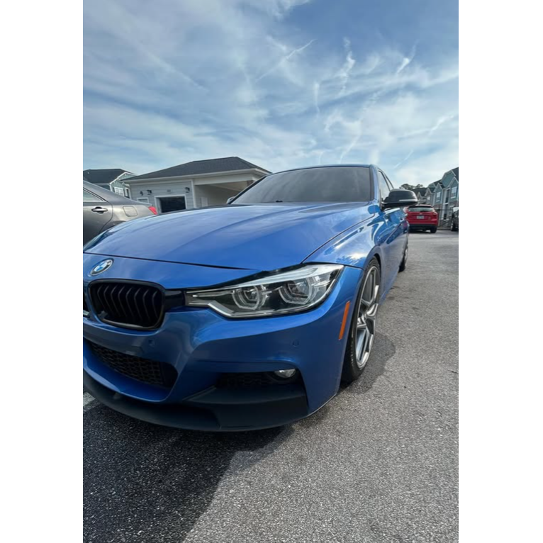 Blue BMW showcasing a clean, glossy exterior after professional detailing. Mobile Glo Detailing prov 