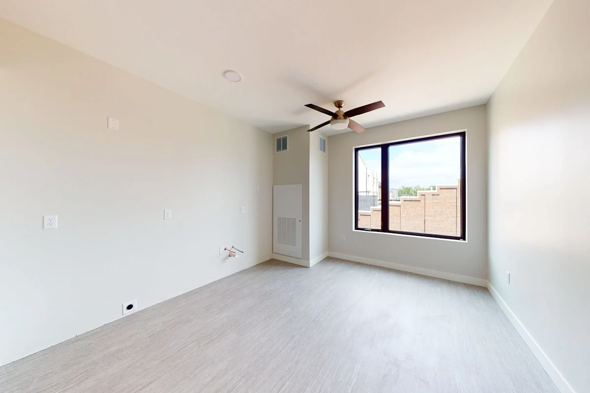 Spacious bedroom with large window