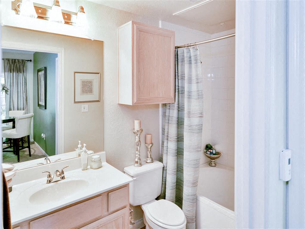 Bathroom with pink cabinets