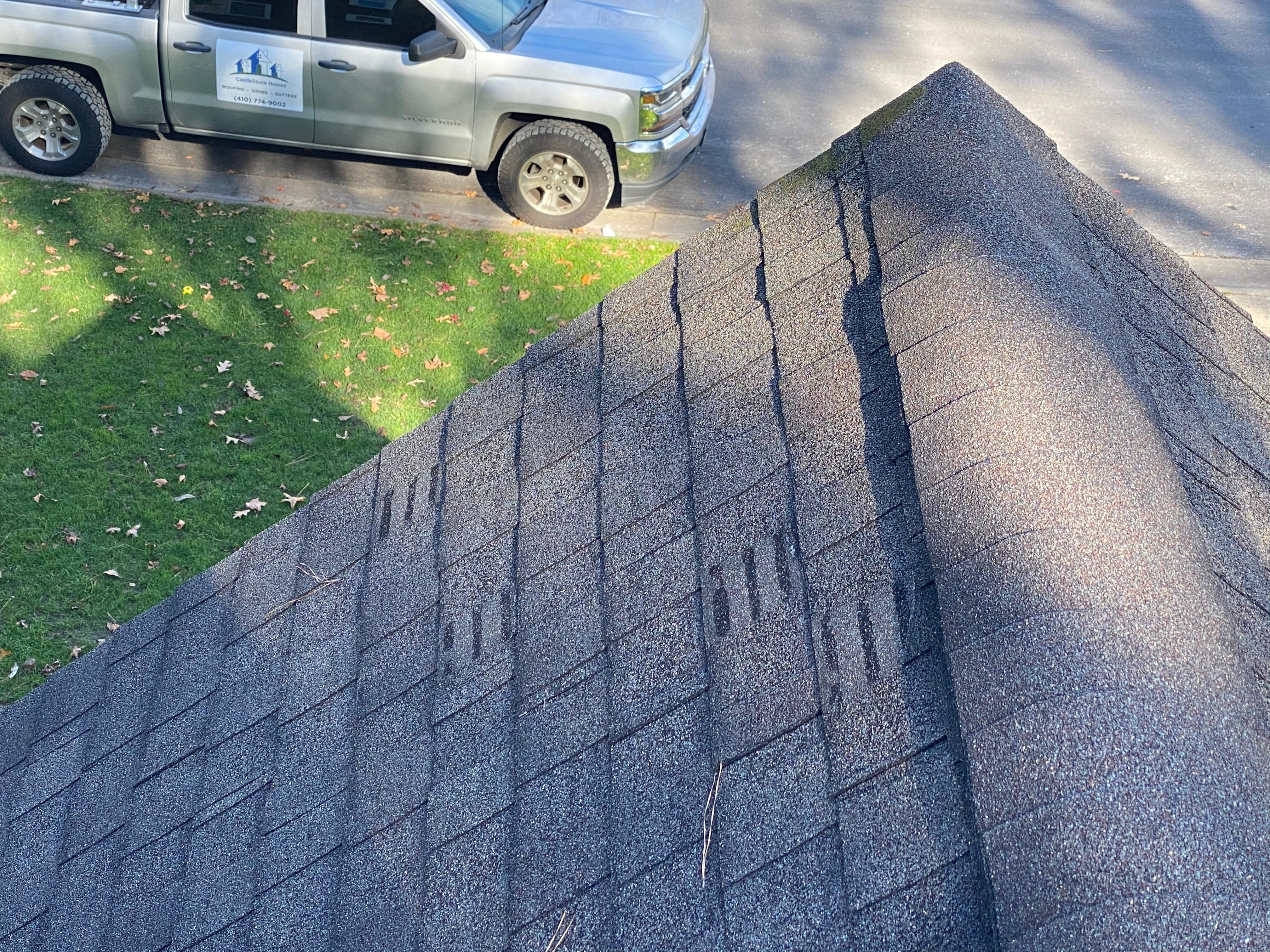 Wind damage to architectural shingles. Surprisingly, very difficult to see from the ground.