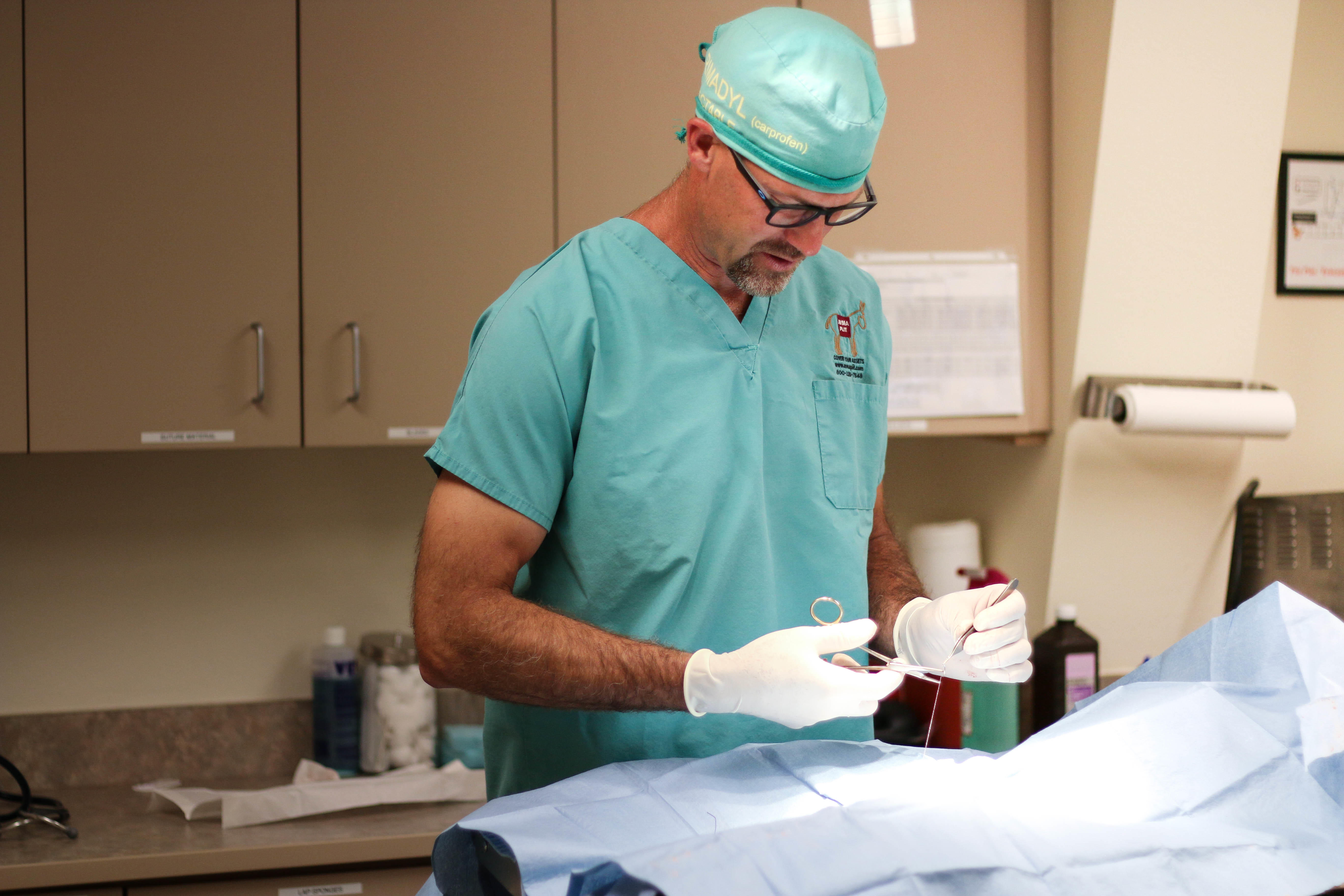 Dr. Jeremy Ley is focused and hard at work while performing a surgery.