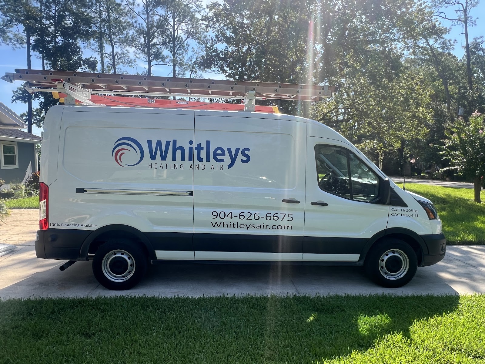 A white Ford Transit van with 