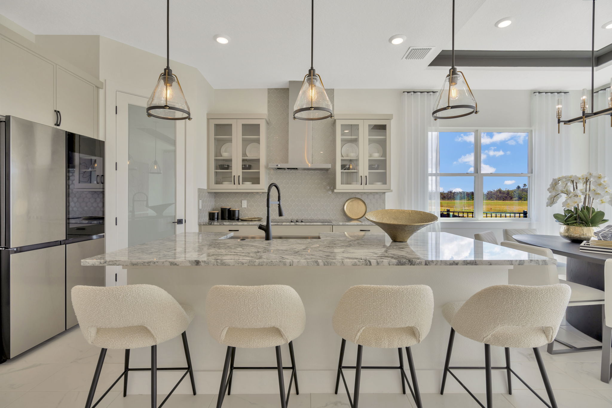 The Kitchen of a DRB Homes Eider Home Plan at Biscayne Landing at Seaire in Parrish, FL.
