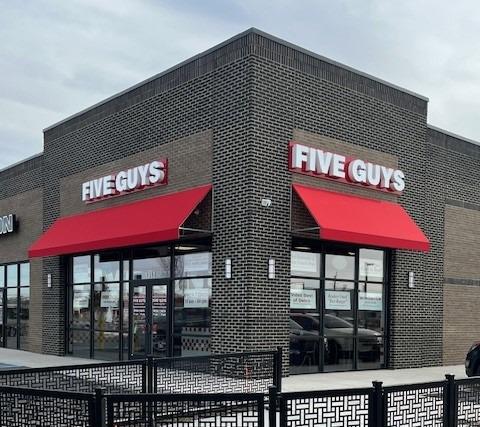 Exterior photograph of the Five Guys restaurant at 1312 N. Telegraph Road in Monroe, Michigan.