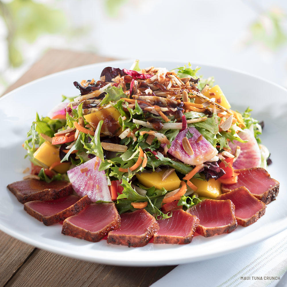 Maui Tuna Crunch Salad - seared handline tuna, organic greens, mango, almonds, wood-grilled red peppers, toasted sesame dressing