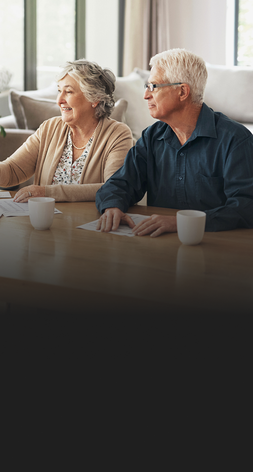 A couple shaking hands with their advisor.