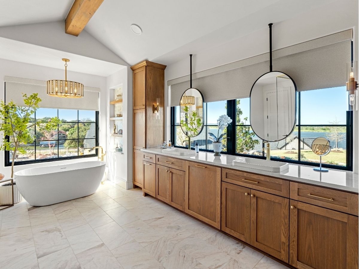 Modern master bathroom featuring Enlightened Style roller shades, providing soft natural light, privacy, and a clean, minimalist look.