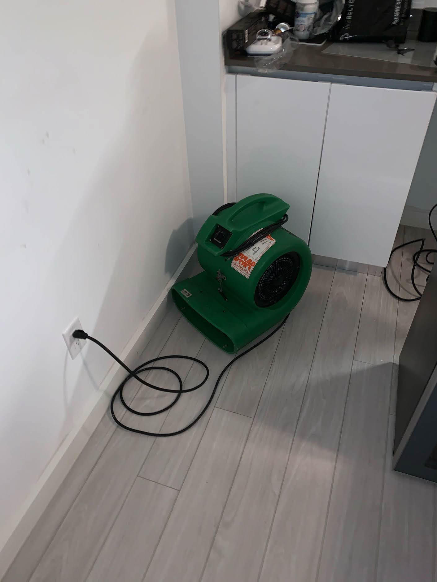 Setting up drying equip in a water damaged home. SERVPRO of Brickell is here to help.