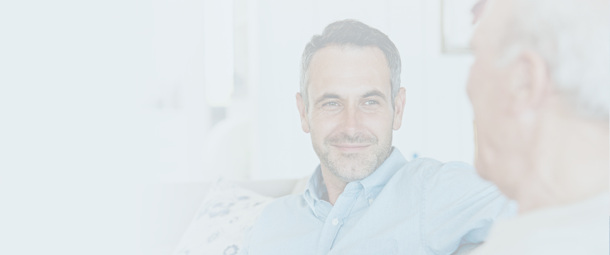 An advisor speaking with an elderly client.