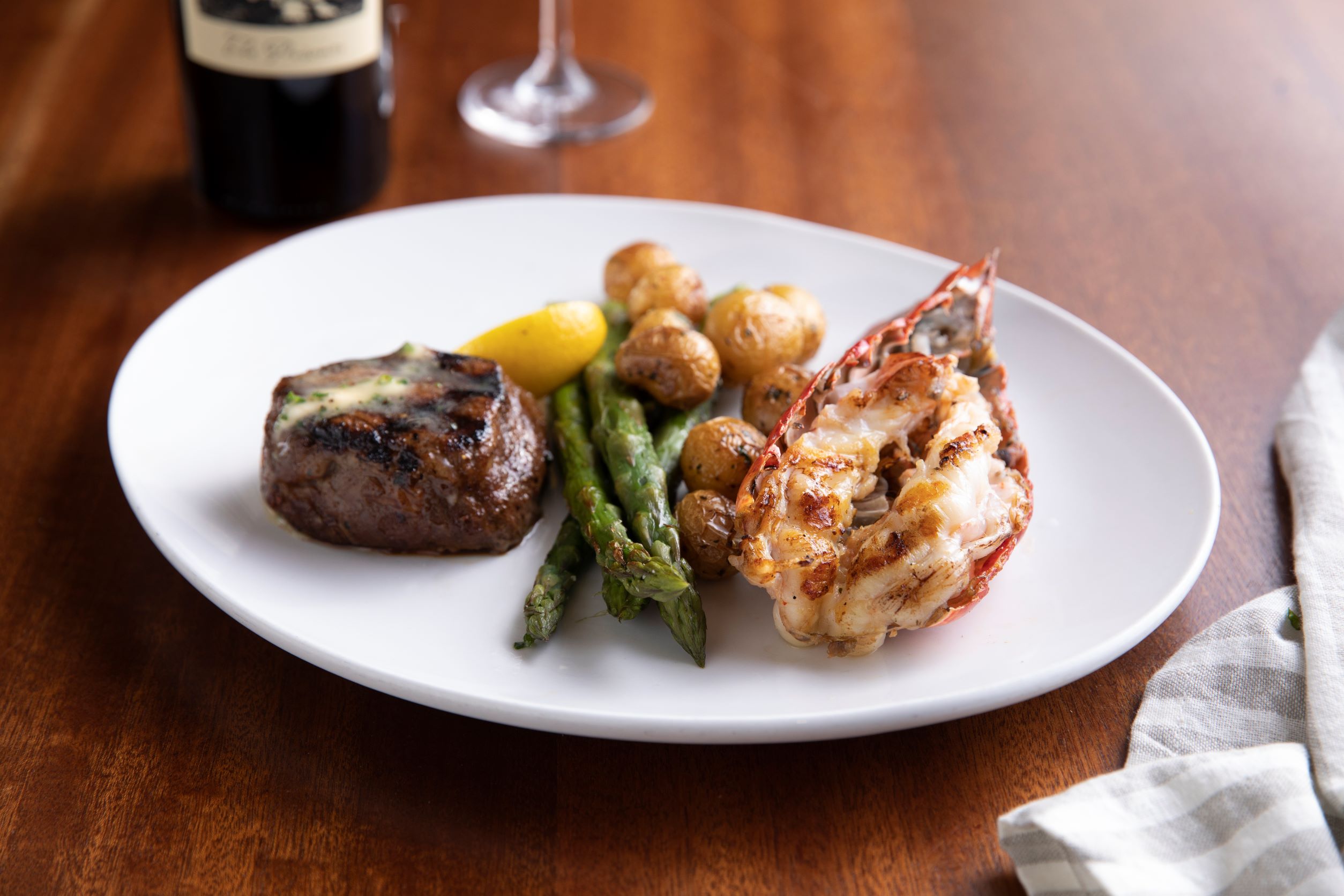 Filet Mignon and Main Lobster Tail - roasted asparagus, marbled potatoes, herb butter