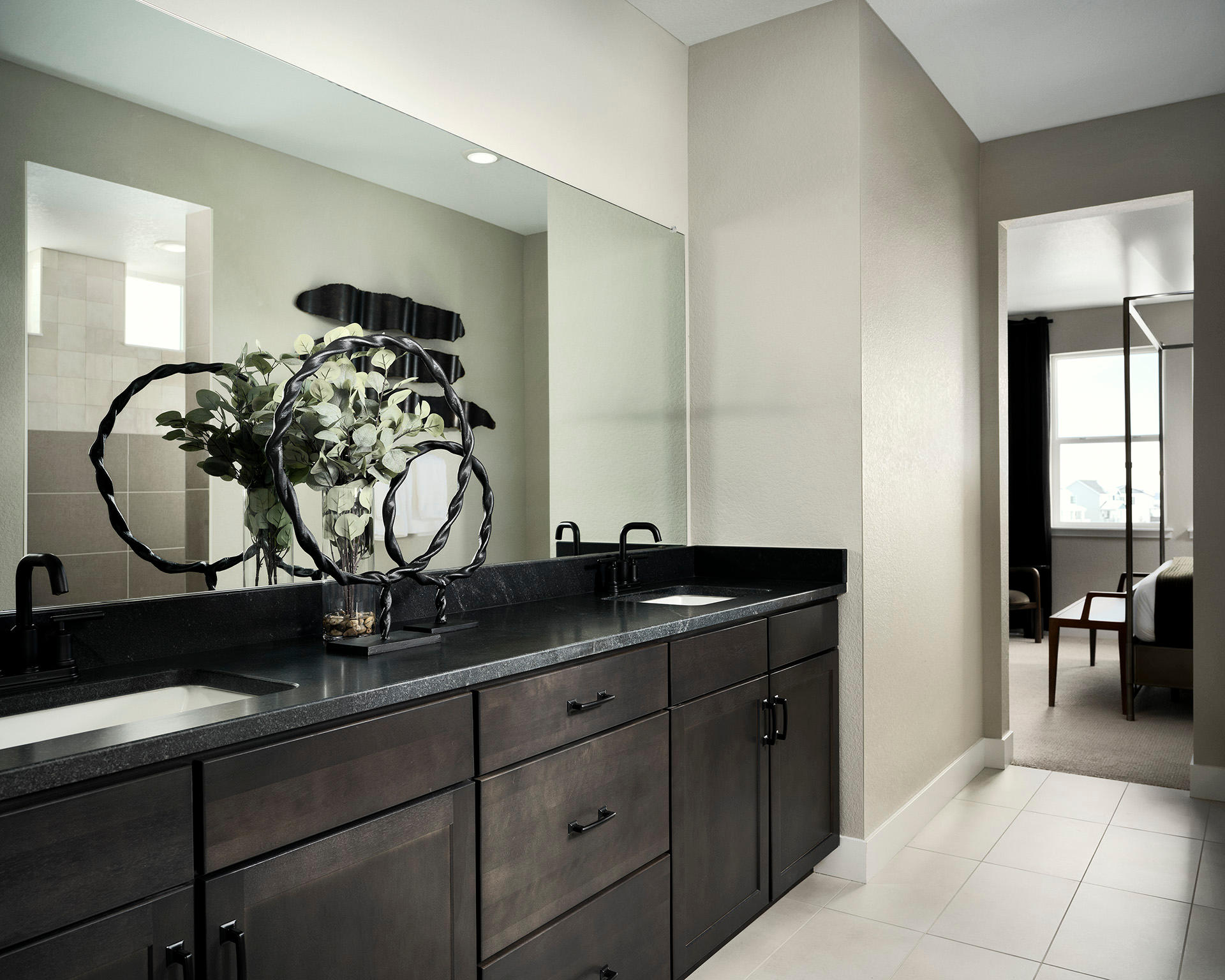 Spacious walk-in shower, dual sink vanity and large mirror in Owner’s Bath in Parklane new construction home.