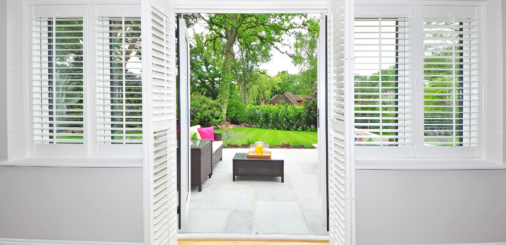 We love the look of shutters for living rooms and patio doors. The team at Budget Blinds of Rockwall, Terrell, and Greenville loved getting to install shutters at our client's new home in Canton, TX