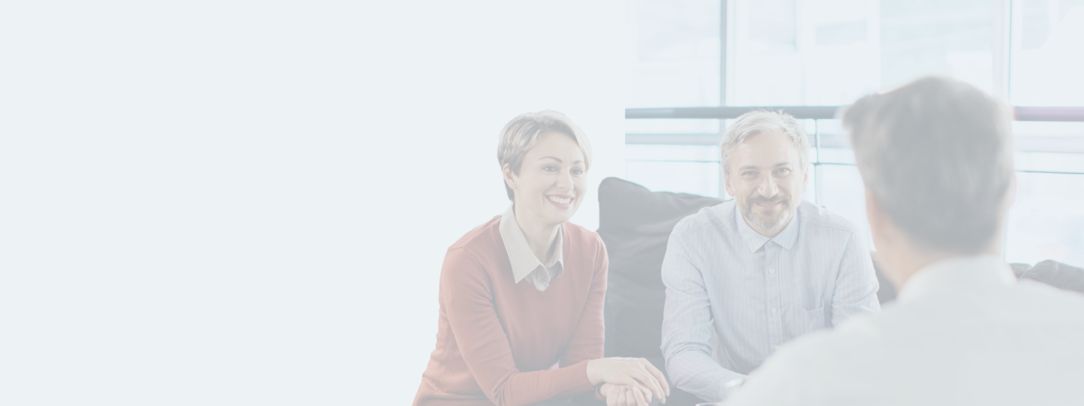 Couple sitting in front of a wealth professional.