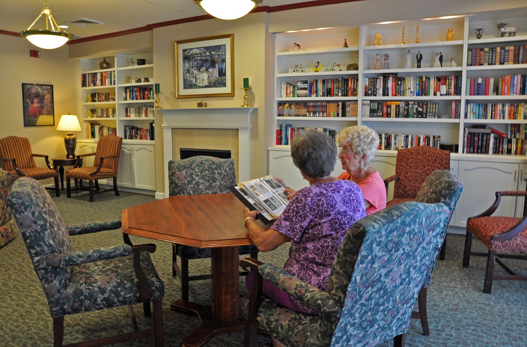 Oak Woods Manor library space. Enjoy a book with a friend by the fire.