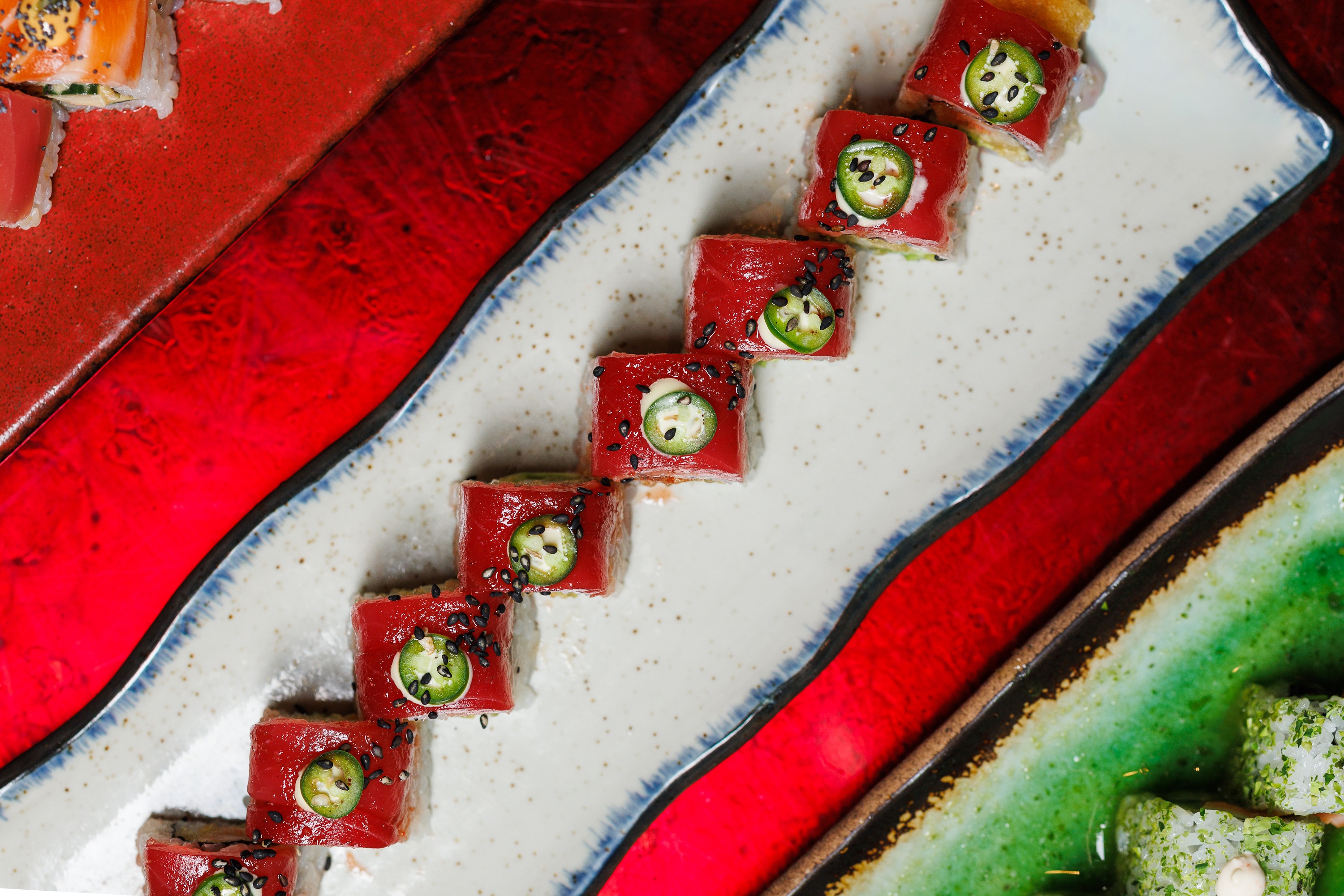 Discover the Red Dragon Roll at Mr. H, an Asian fusion restaurant in Boston's Seaport. Featuring sli 