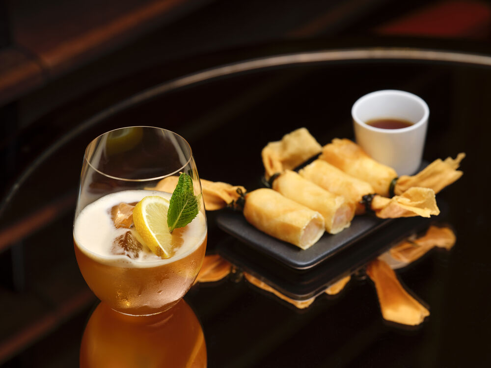 Prawn spring rolls paired with a cocktail