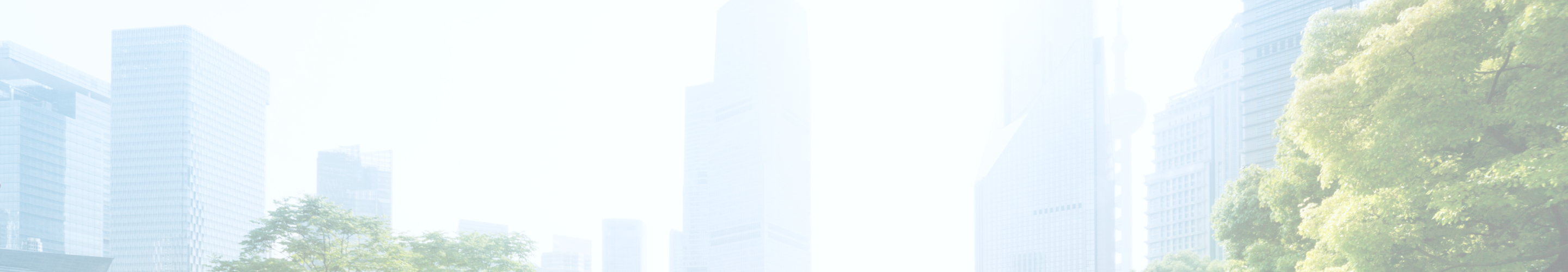 Office buildings in a city surrounded by trees.