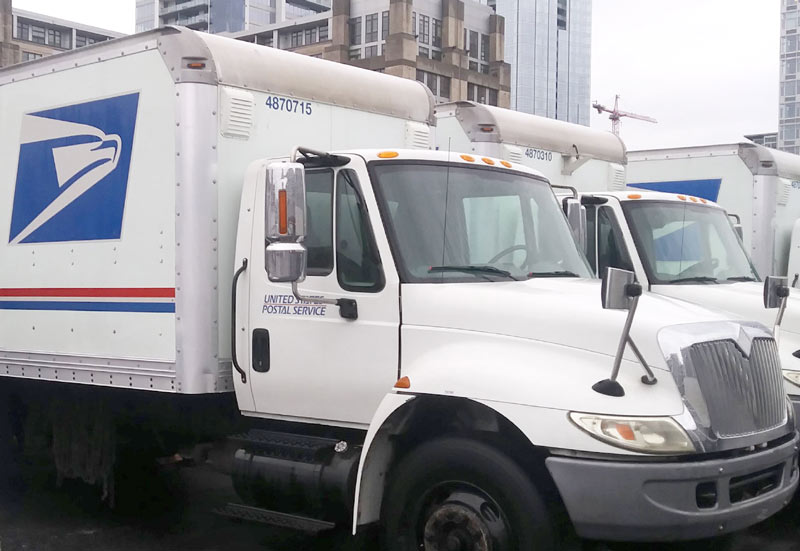 Snugs Services technician providing professional fleet washing for a commercial fuel delivery truck  