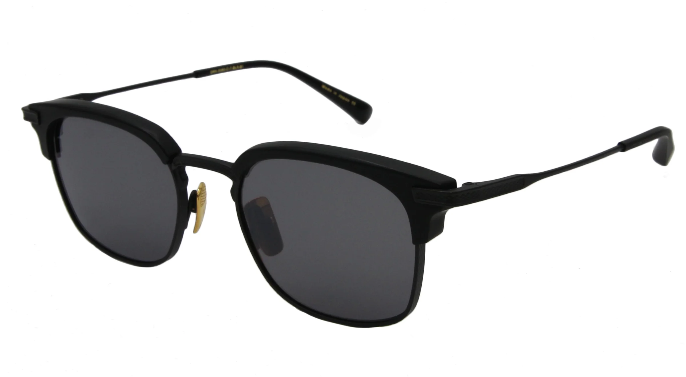 A pair of black Dita designer sunglasses with dark gray lenses and gold nose pads are shown against a white background. The sunglasses have a square-ish frame with clean lines and thin temples. They appear to be made of metal and plastic.