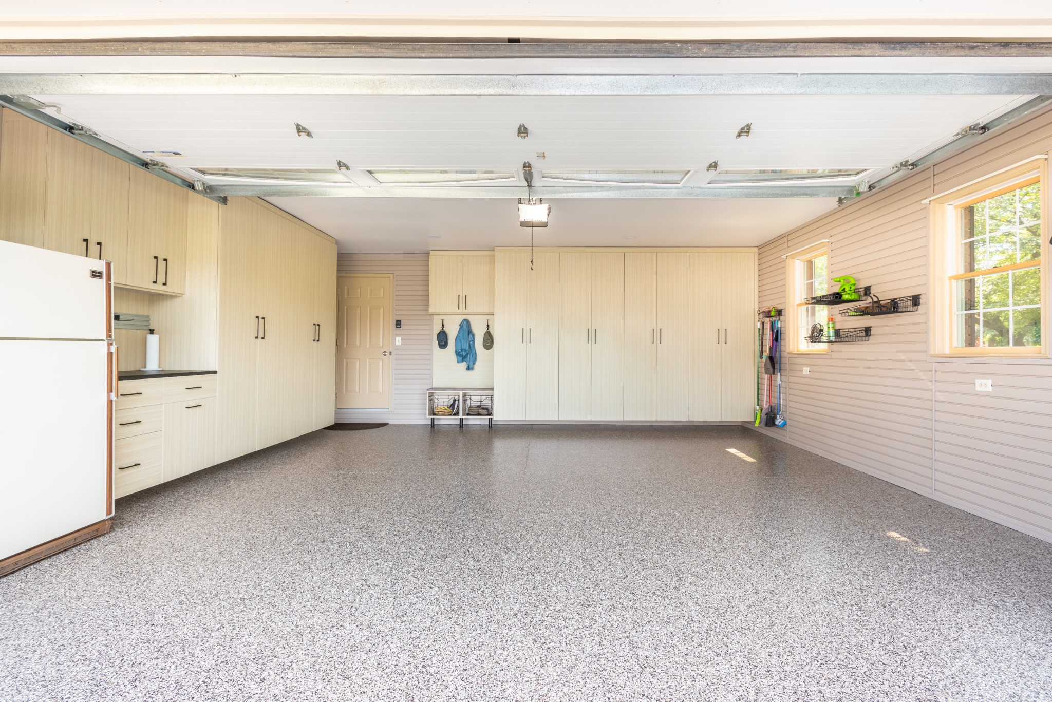 There's a place for everything in this Lancaster garage! A drop zone, storage lockers, custom workbench, wall storage and a durable epoxy floor complete this once lifeless, disorganized space.