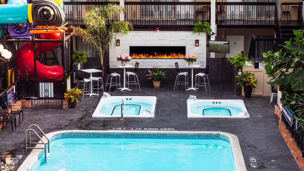 New sunken hot tub at the pool and fireplace feature Best Western Plus Cairn Croft Hotel Niagara Falls (905)356-1161