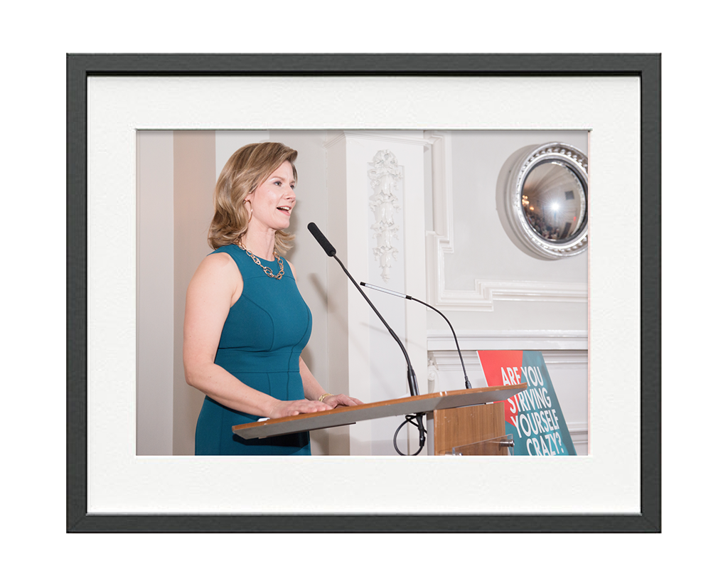 Claire Booth speaking at an event.