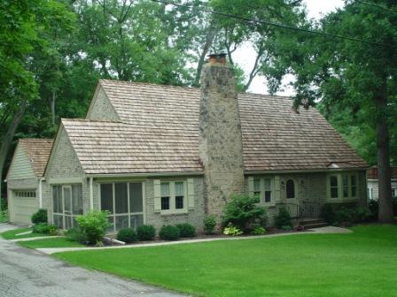 Here is a Cedar Shake Roof that we've put on in the past. We love this unique look to houses that make them stand out!
