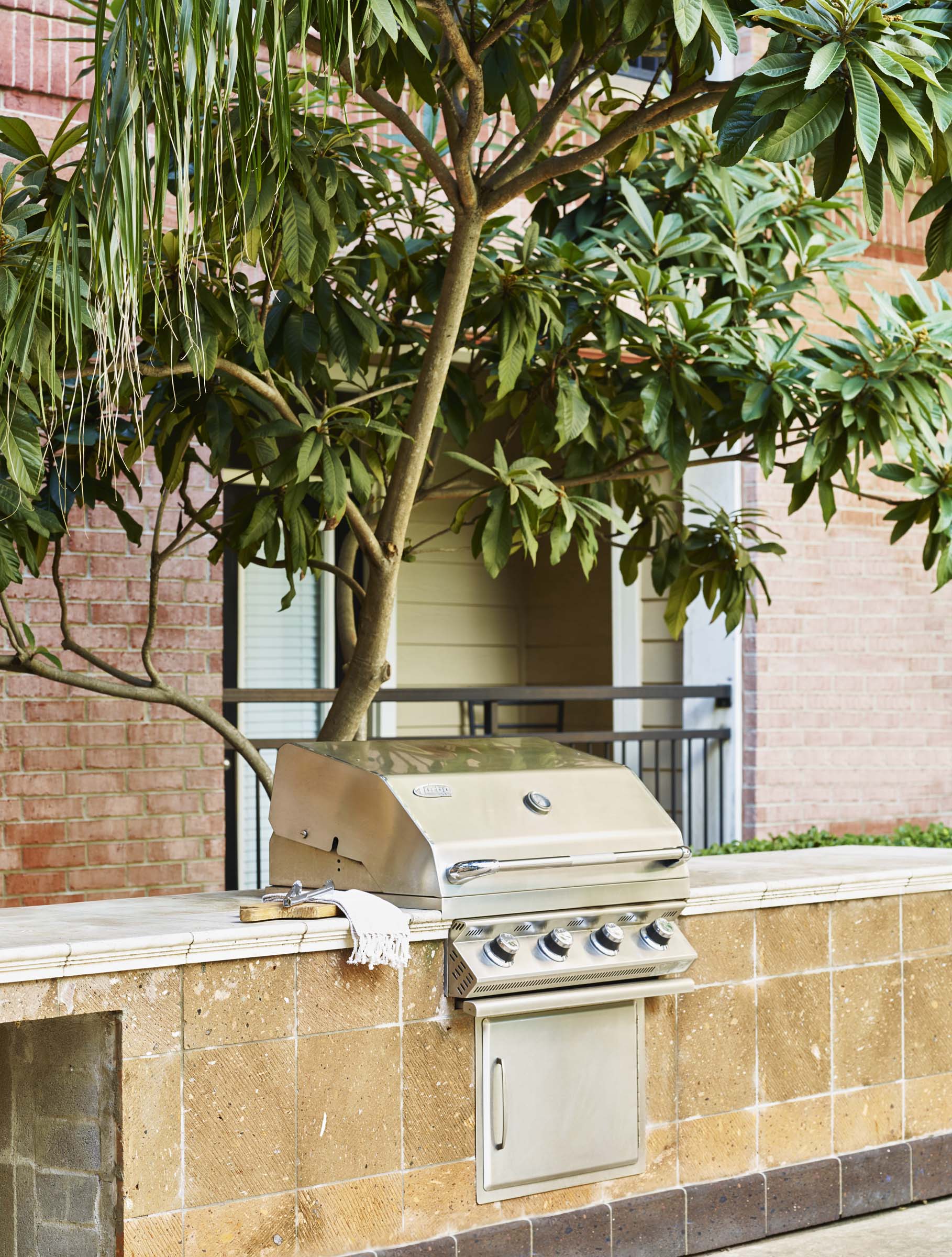 Poolside barbeque grills at Camden Plaza Apartments in Houston, TX
