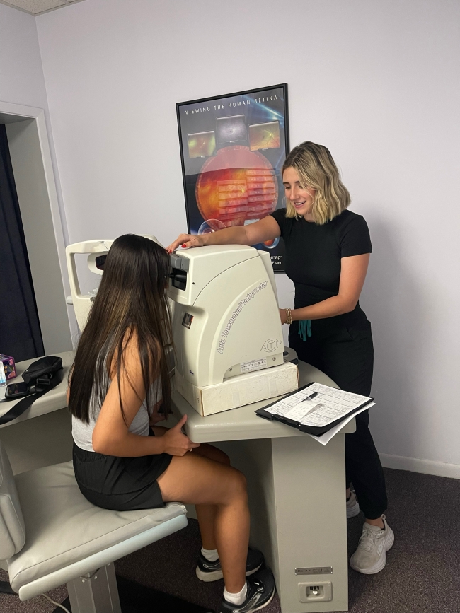 Patient receiving an eye exam. 