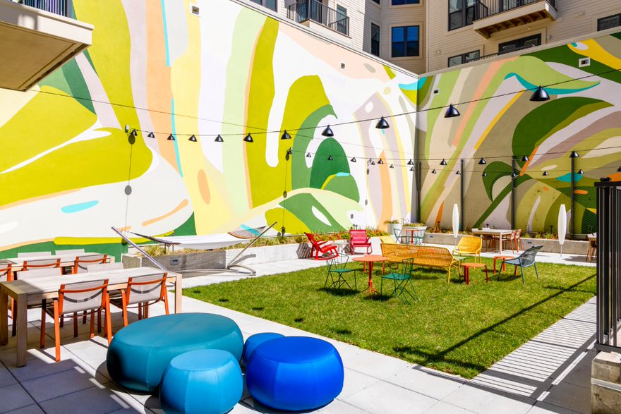 Hang out and snap a selfie in front of our colorful courtyard mural.