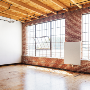 This primary carousel image for the Pilot Home Inspections website highlights our specialized commercial property inspection services in Southeast Idaho. The image features a clean, industrial-style commercial interior with exposed brick and large-scale windows, symbolizing the thorough structural and systems assessments we provide for business owners and investors. We offer comprehensive commercial reports covering HVAC, electrical, plumbing, and structural integrity for offices, retail spaces, and industrial buildings in Idaho Falls, Ammon, and the surrounding regions.