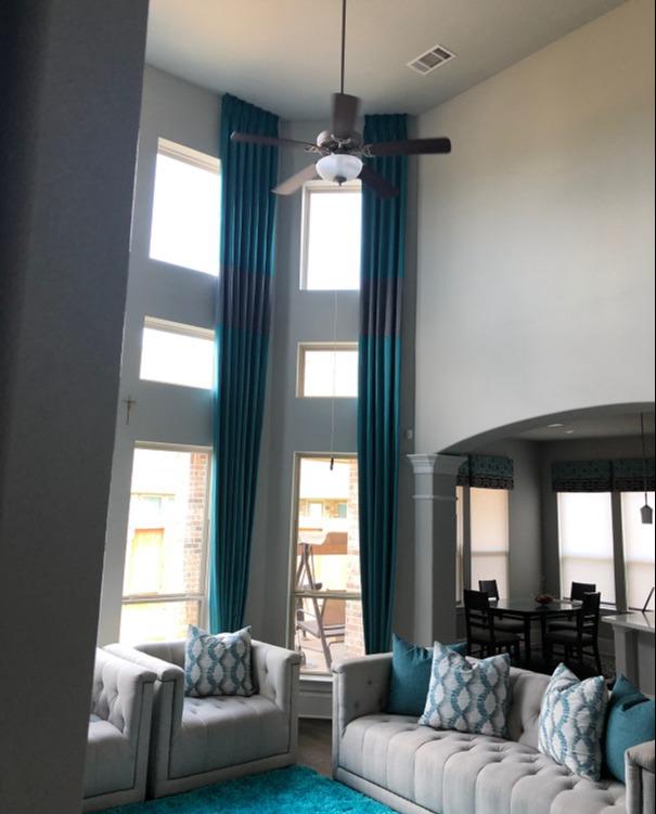 Bring attention to your gorgeous windows with the right window treatments! We love how these Block Drapery Panels draw attention to the sky-high ceilings in this Katy, TX, home. #BudgetblindsKatySugarLand #KatyTX #DraperyPanels #FreeConsultation #WindowWednesday