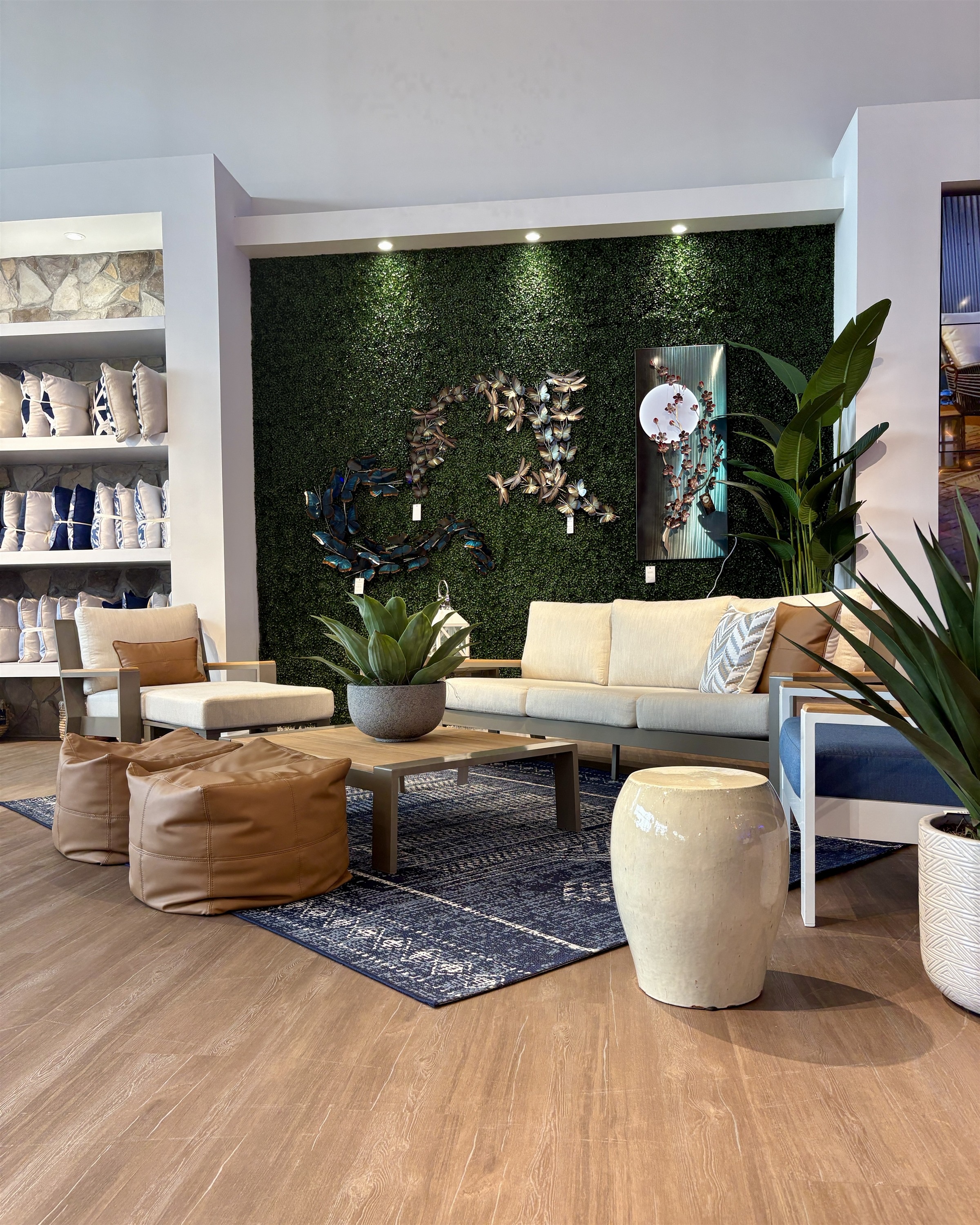 Relax in style with this modern beige outdoor sofa and lounge chair set featuring leather bean bag ottomans, available at Rooms To Go for 2026.