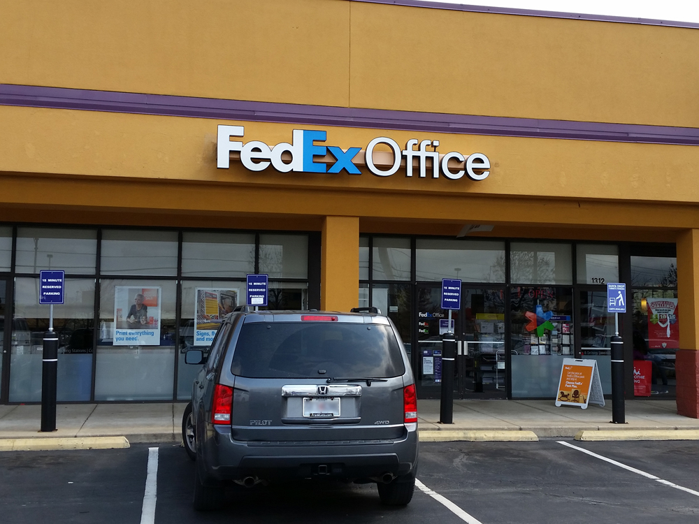Exterior photo of FedEx Office location at 1312 Hwy K\t Print quickly and easily in the self-service area at the FedEx Office location 1312 Hwy K from email, USB, or the cloud\t FedEx Office Print & Go near 1312 Hwy K\t Shipping boxes and packing services available at FedEx Office 1312 Hwy K\t Get banners, signs, posters and prints at FedEx Office 1312 Hwy K\t Full service printing and packing at FedEx Office 1312 Hwy K\t Drop off FedEx packages near 1312 Hwy K\t FedEx shipping near 1312 Hwy K