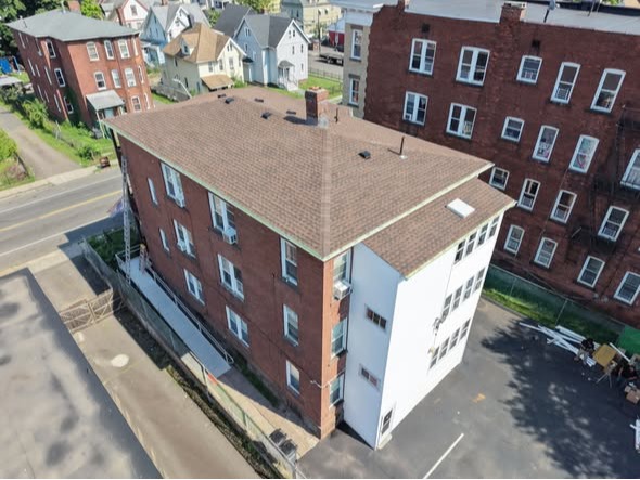 new roof on an apartment building KLS Construction LLC 
